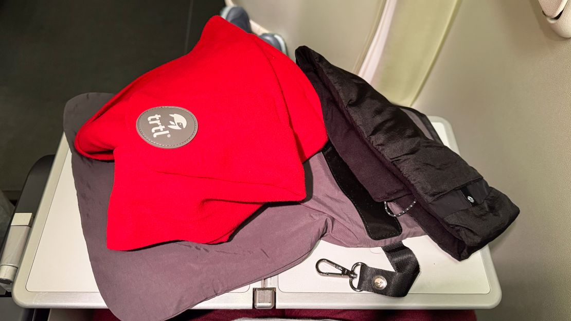 Trlt pillow on tray table of airplane