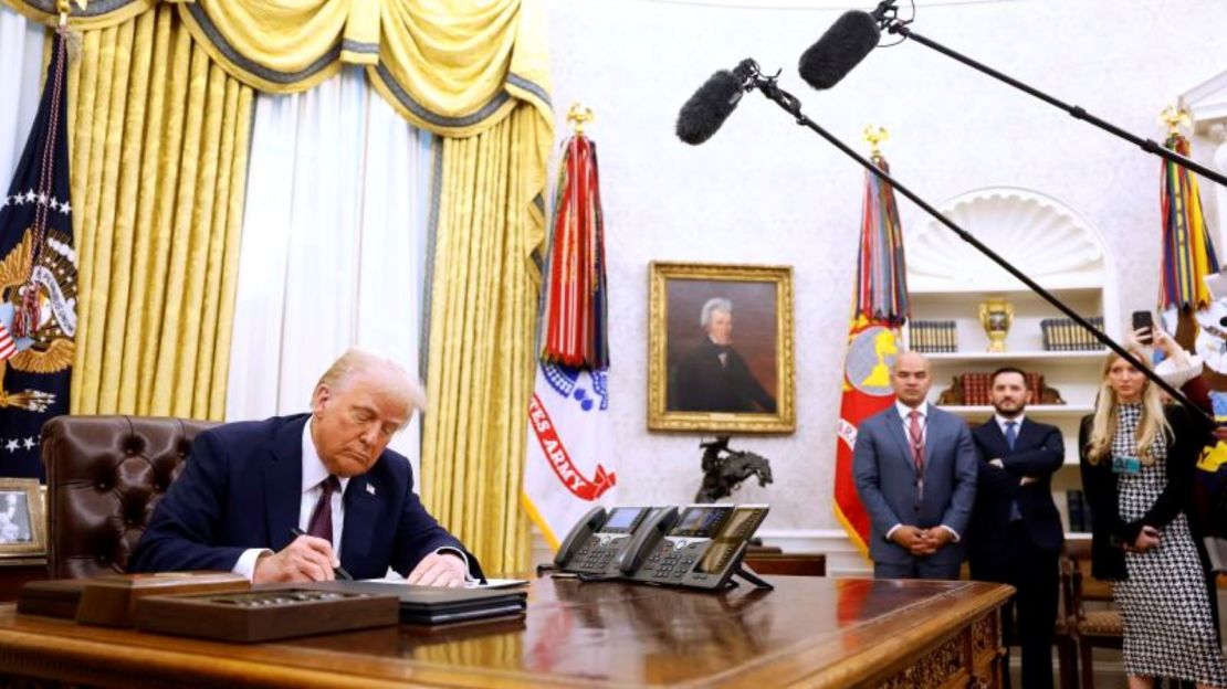 President Donald Trump signs a series of decrees in the Oval Office of the White House on Thursday, January 23, 2025.