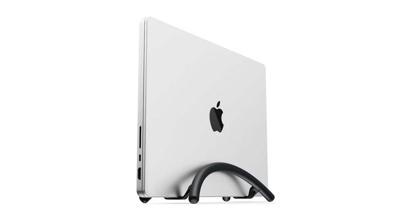 A MacBook vertically positioned in the Twelve South BookArc Flex on a white background.