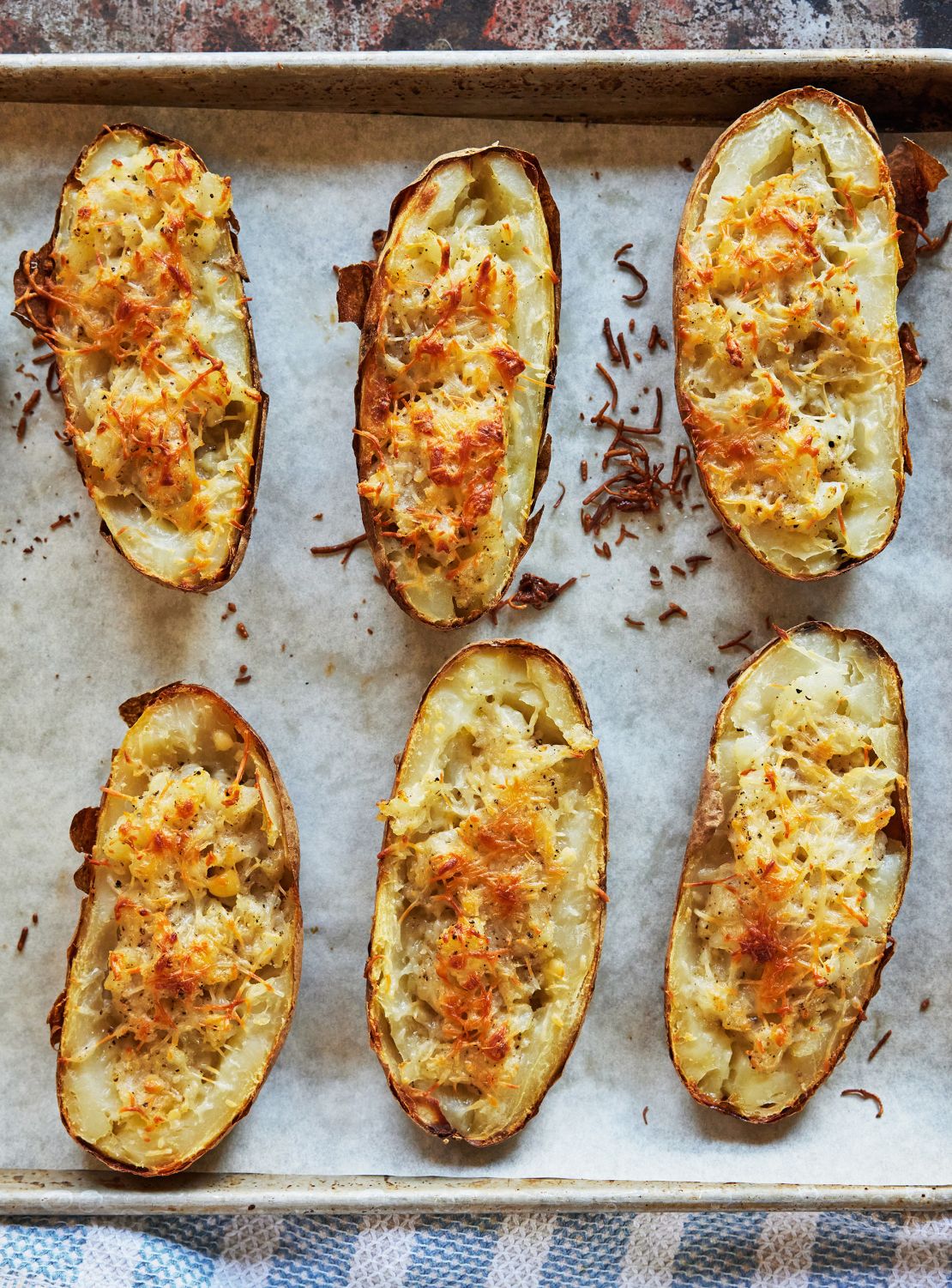 Turshen suggests baking the potatoes a few days in advance for this cozy dish with the flavor of cacio e pepe pasta.