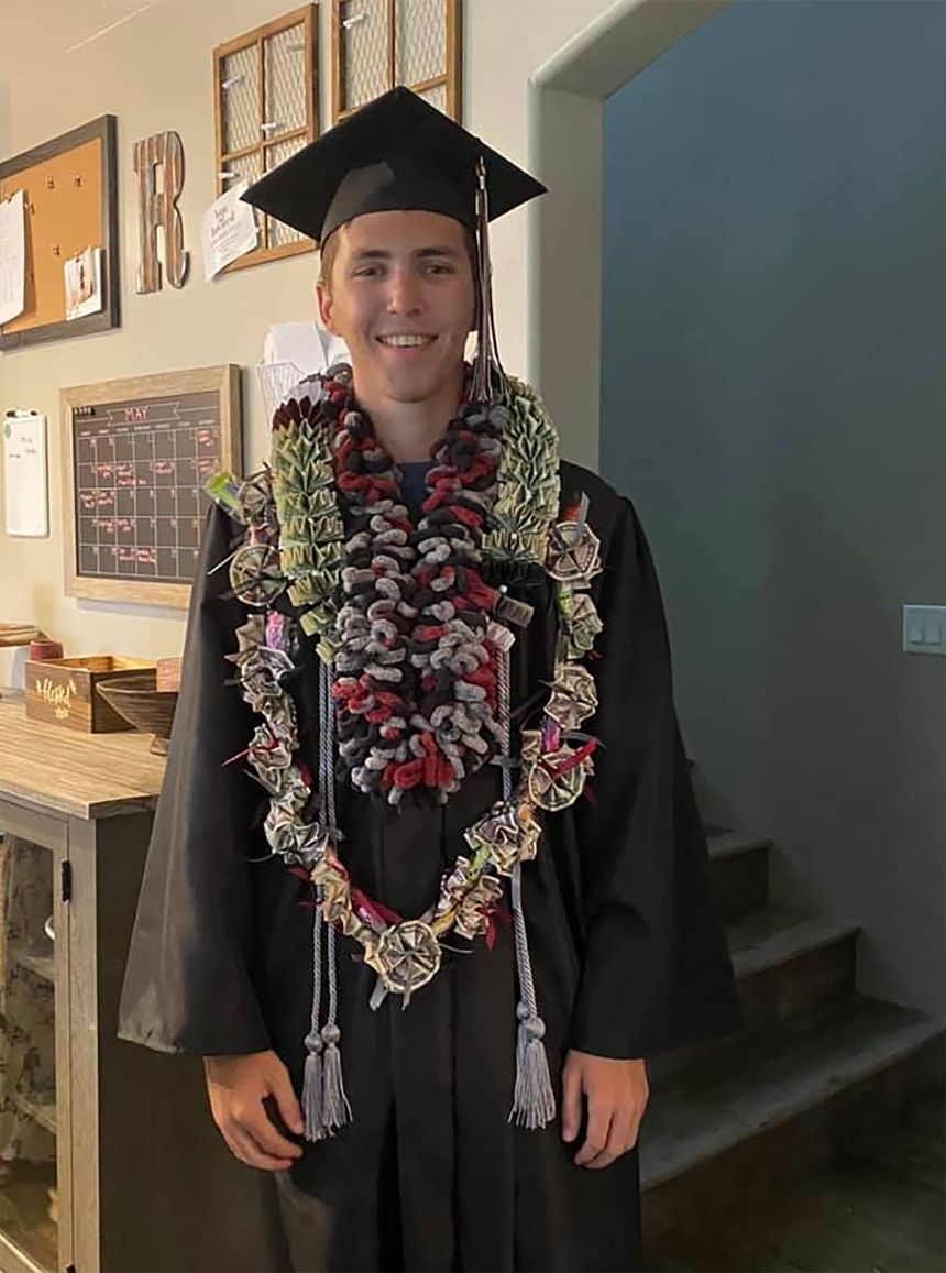 Tyler Robinson is seen wearing a cap and gown in a social media photo.