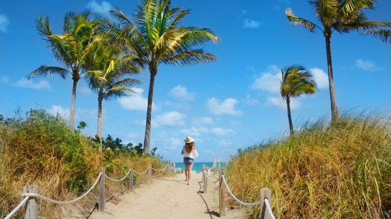 underscored book spring break travel now lead woman on beach