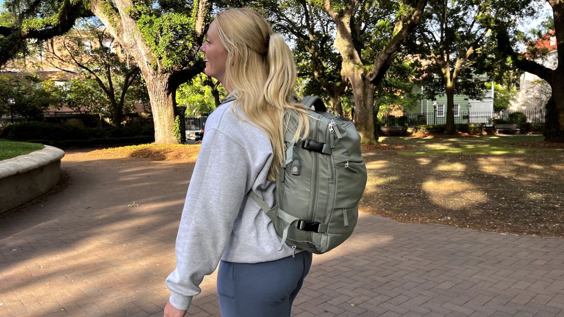 A photo of a person wearing a Coowoz backpack