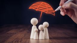 supplemental life insurance family icons under red umbrella