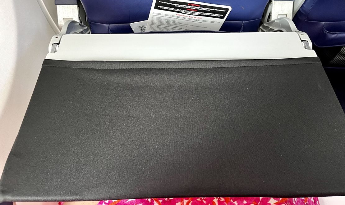 Under $50 scores: This airplane tray table cover keeps your travel  essentials clean and organized