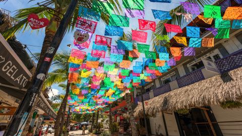 Colorful flags line a street in the town of Sayulita in Mexico.