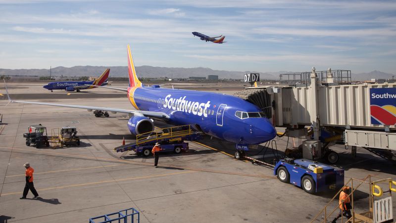 How I Beat Expensive Summer Travel By Booking An All Inclusive Trip To   Underscored Southwest Airlines Plane At Gate 