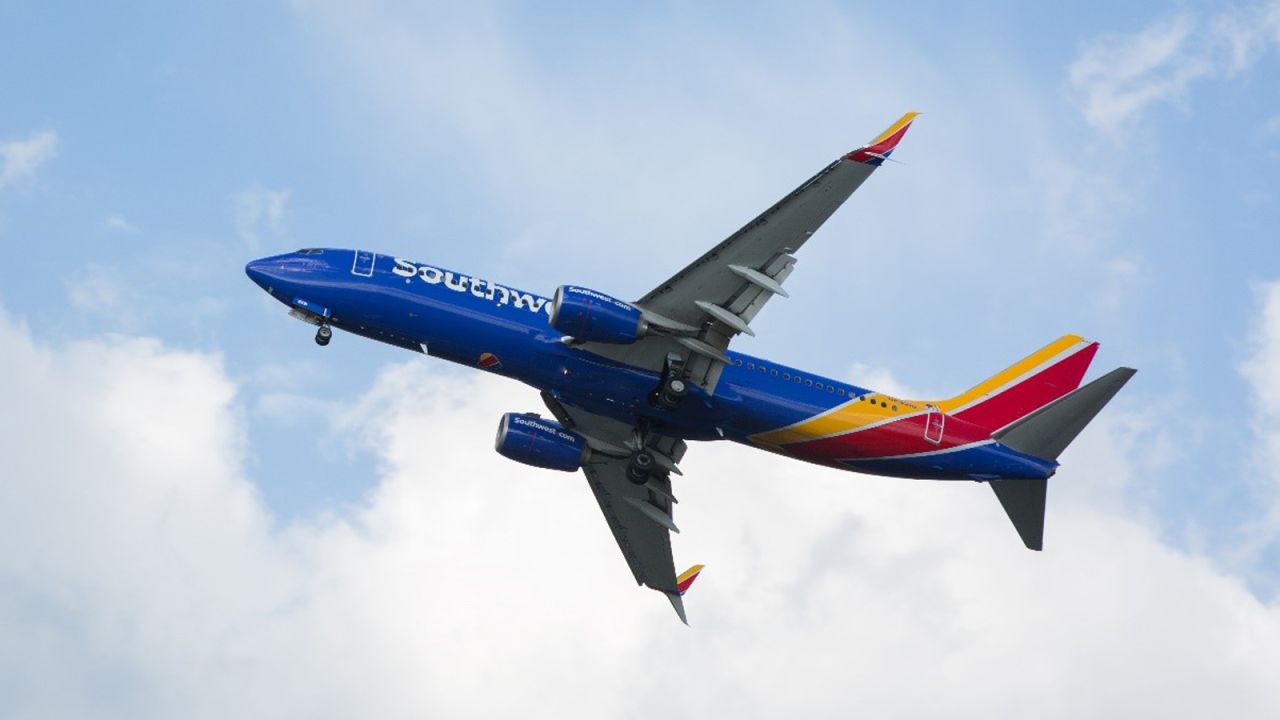 southwest plane from underneath cloudy sky