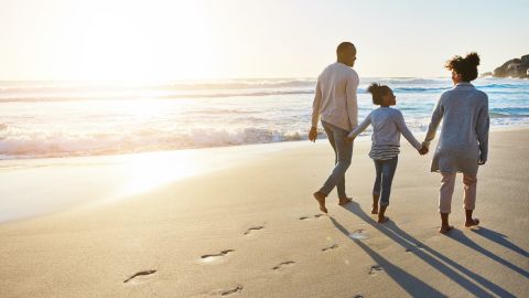 underscored travel rewards strategies lead family on beach