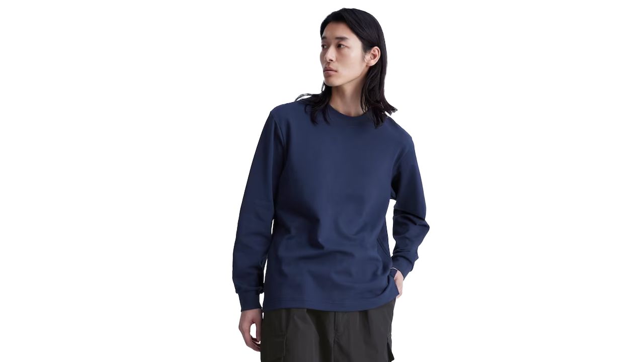 Man wearing blue Uniqlo airism long-sleeve t-shirt