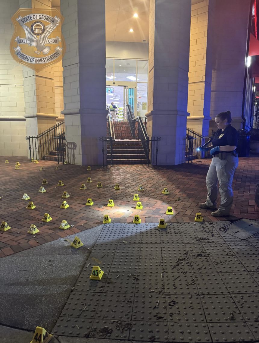 Shell casings litter the sidewalk as GBI agents investigate Friday’s shooting targeting CDC headquarters in Atlanta, Georgia.