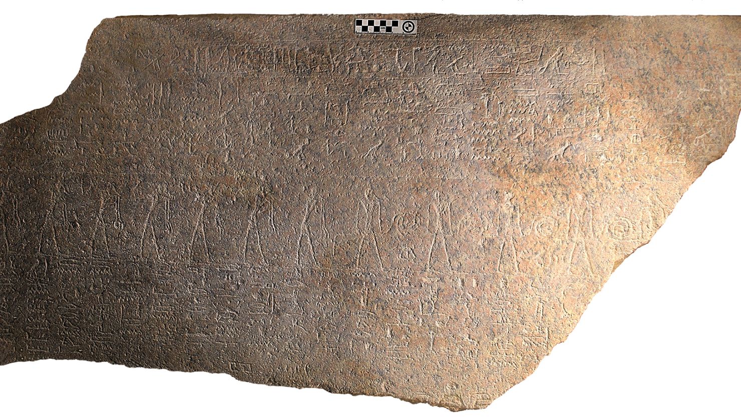 Egyptologist Frédéric Payraudeau deciphered the hieroglyphs engraved on this granite fragment and determined the fragment was part of a sarcophagus that once belonged to Ramesses II.