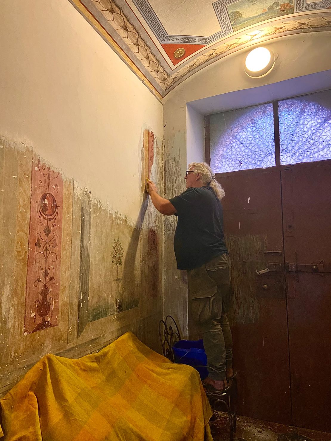 Jess and Kelly have been painstakingly removing the paint covering some hidden frescoes in the property.
