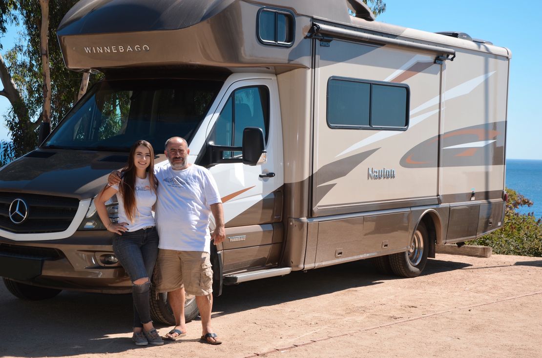 Nika Shneyder and her father and business partner, Alex Shneyder, standing by a Chill RV in Malibu RV Park, California, in 2019.