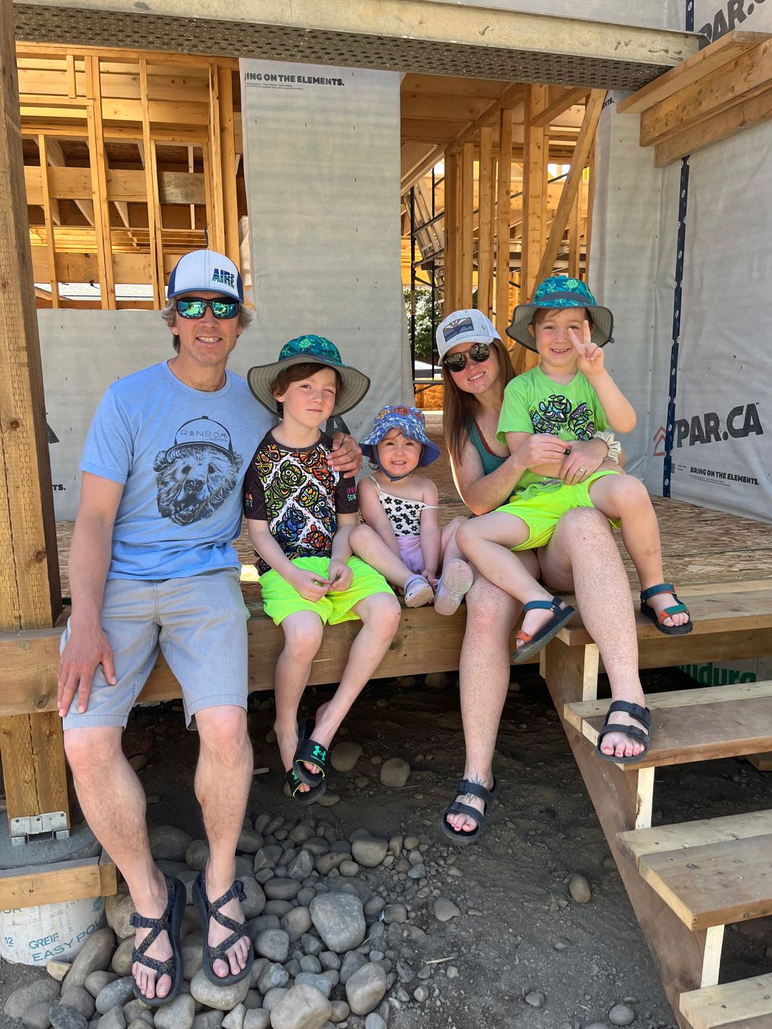 James Gillese and his wife, Krista, are pictured with their children on the porch of what would have been their new home.