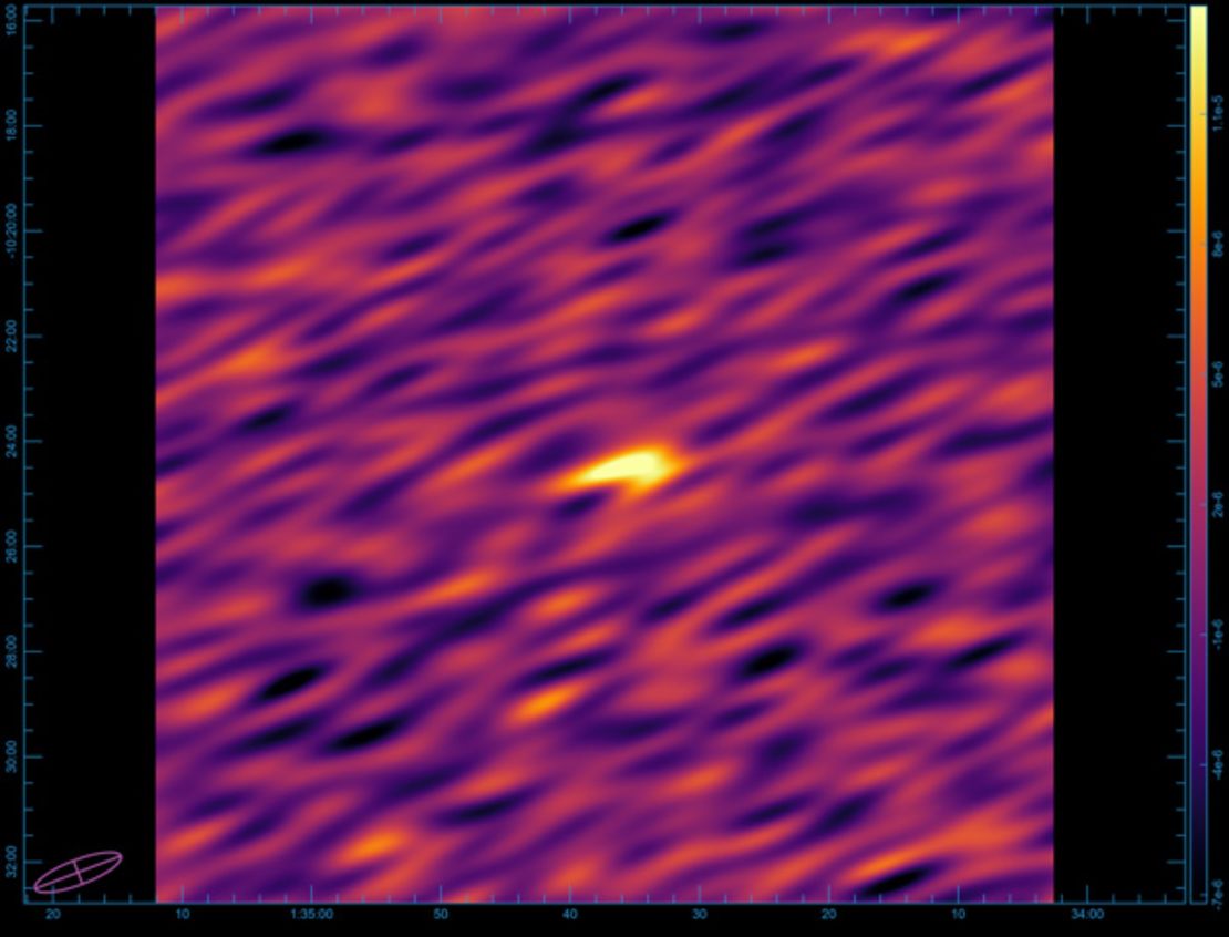 Shown above is the blurry image that left the astronomers scratching their heads, with the signal as a bright spot in the center.