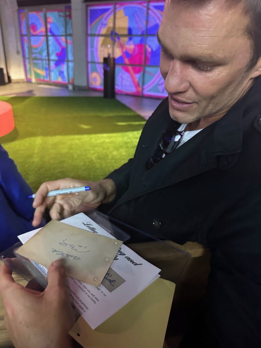 Patrick Ryan got Tom Brady to be the first to sign the page with Ruth’s signature.