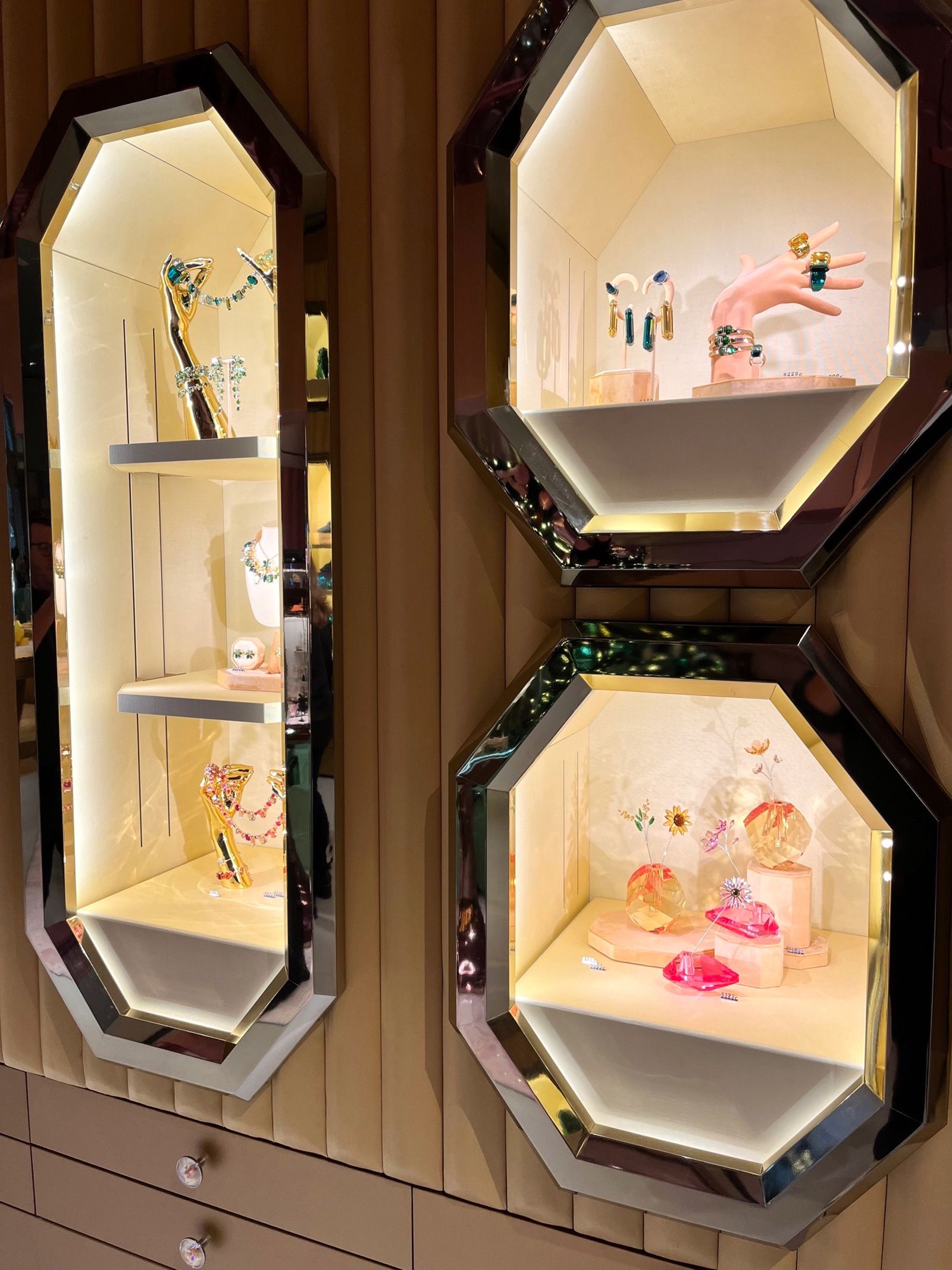 Octagonal display cases, in various sizes, feature throughout the store, showcasing the breadth of Swarovski's product lines.