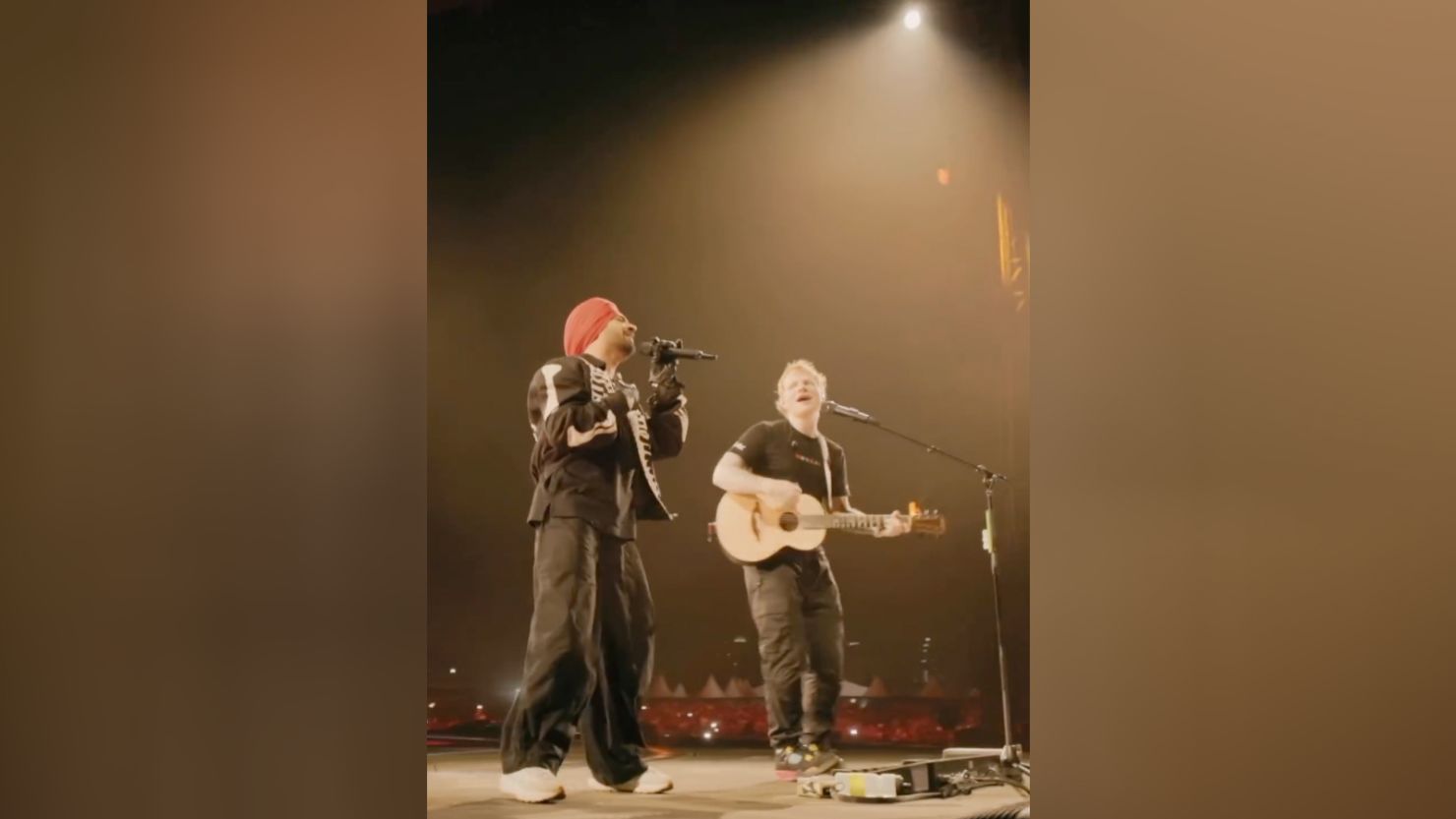 Ed Sheeran and Indian singer Diljit Dosanjh during their performance on March 16, 2024, in Mumbai.