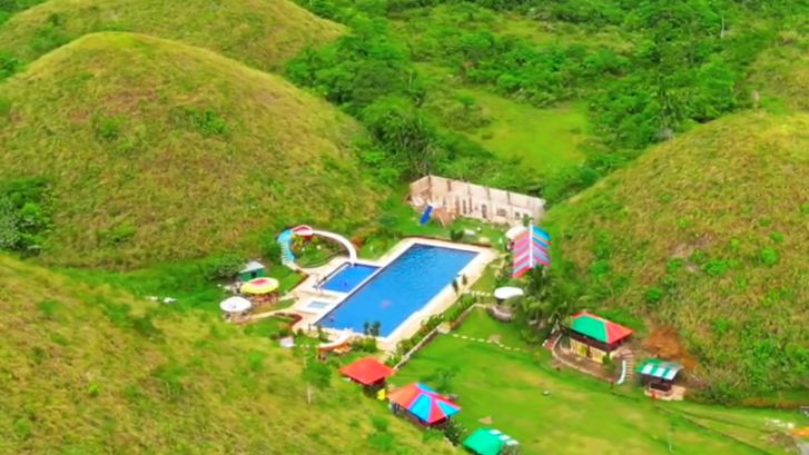 Captain's Peak Garden and Resort nestled in the Chocolate Hills of Bohol, Philippines, captured from a drone shot by a Filipino travel influencer.