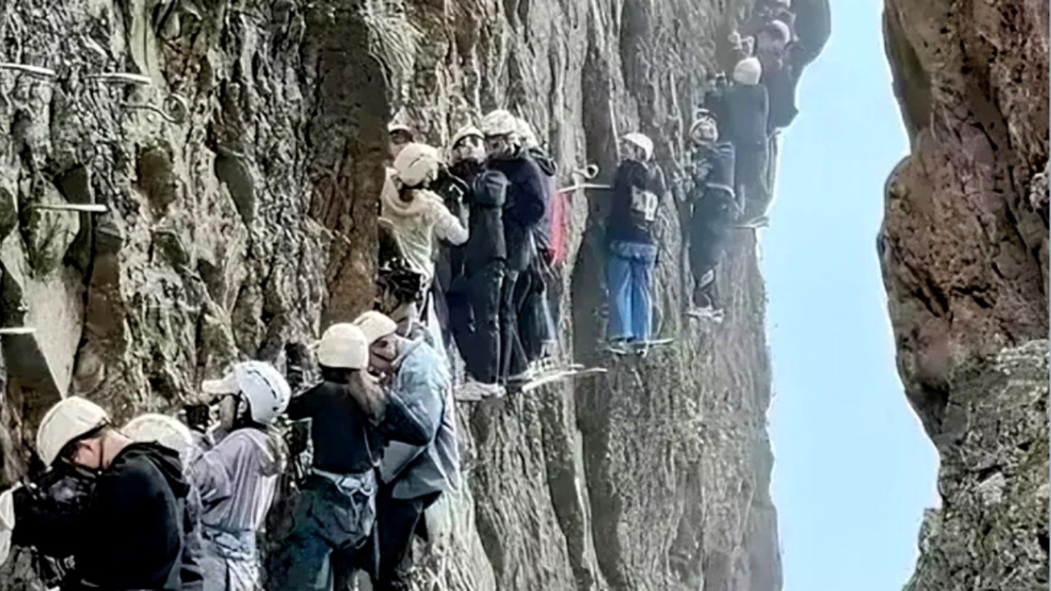 This screengrab shows tourists trapped on a rock climbing trail in eastern China during the Labor Holiday long weekend.