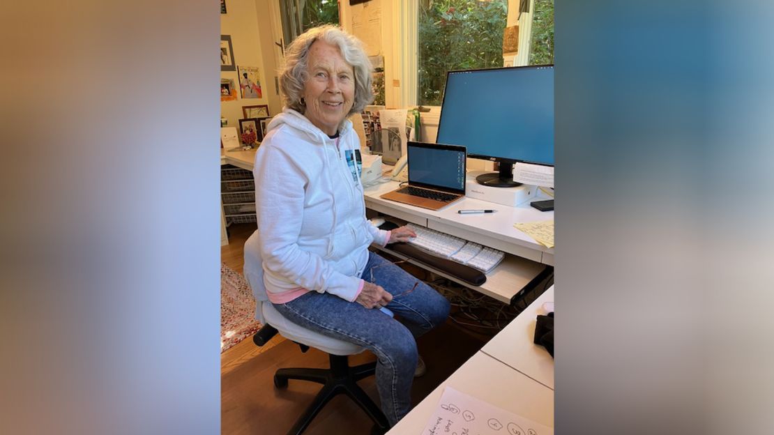 Author Joan Steinau Lester writing in her home office.