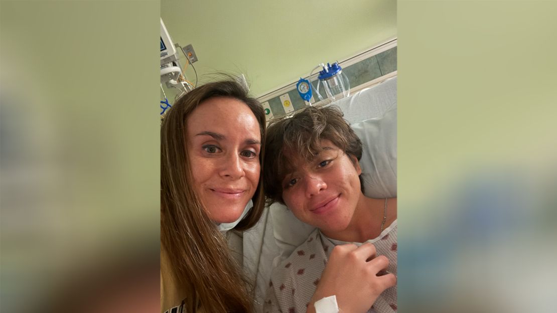 Kahiau Kawai with his mom, Kelehua Kawai, at the hospital after being rescued.