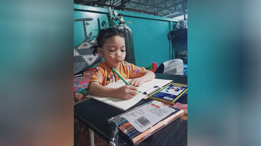 Rosella draws at home while connected to her medical oxygen.