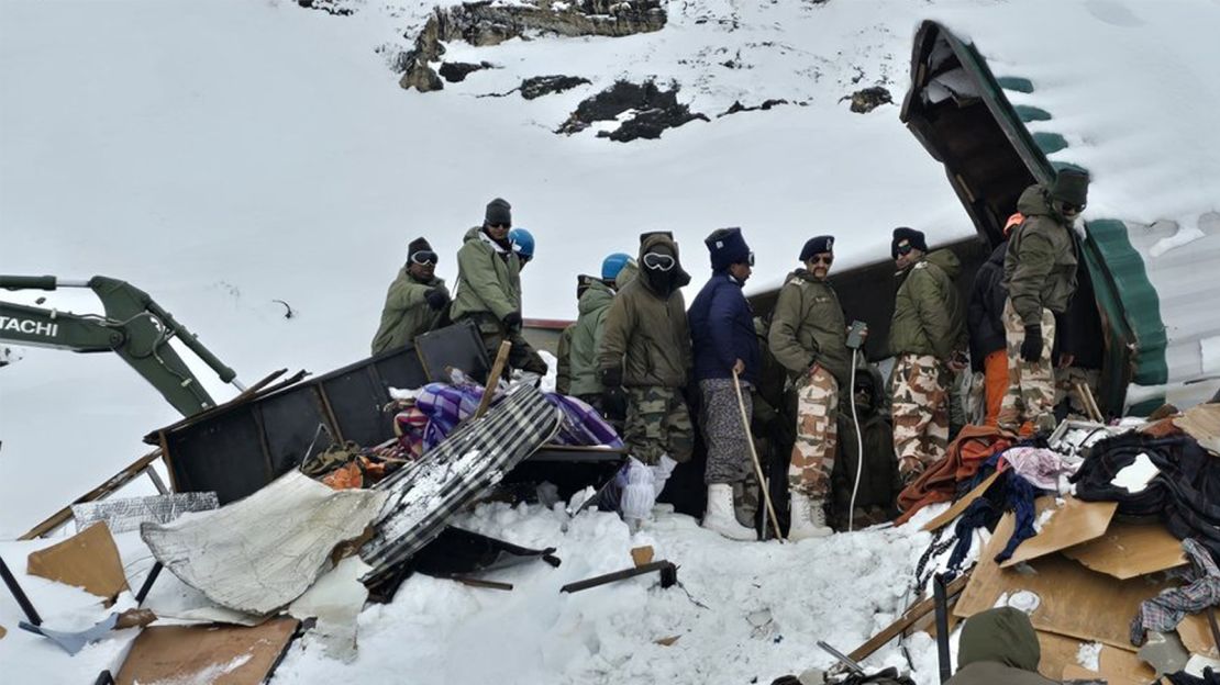 Dozens of construction workers were pulled out alive from metal containers after they were buried by an avalanche for over two days in the Himalayan range in northern India.