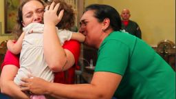 Maikelys Antonella Espinoza Bernal is held by her mother, Yorelys Bernal as her grandmother looks on, upon the child's return to Venezuela at the presidential palace in Caracas on May 14, 2025.