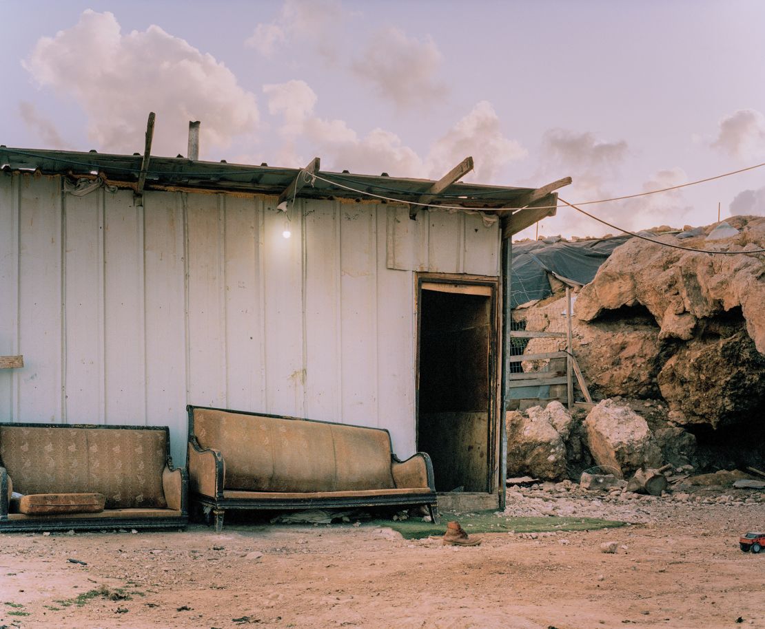 Worn furniture — and a single shoe — outside a Bedouin house in the Jabal Al-Baba community.