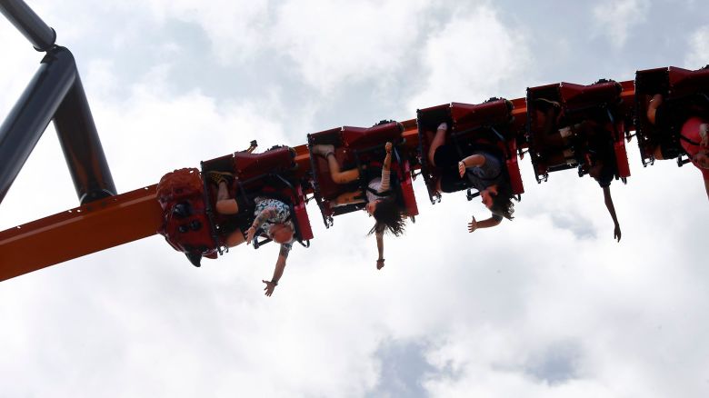 People ride inverted on the Jersey Devil roller coaster at Six Flags Great Adventure in 2021.