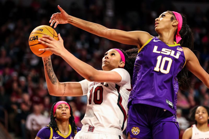 South Carolina Gamecocks center Kamilla Cardoso drives past LSU Lady Tigers forward Angel Reese in the first half at Colonial Life Arena on February 12, 2023, in Columbia, South Carolina.