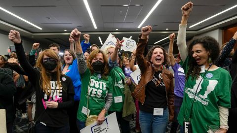 Supporters cheer following the announcement of the projected passage of Issue 1 during a gathering at the Hyatt Regency Downtown in Columbus, Ohio, on Tuesday.