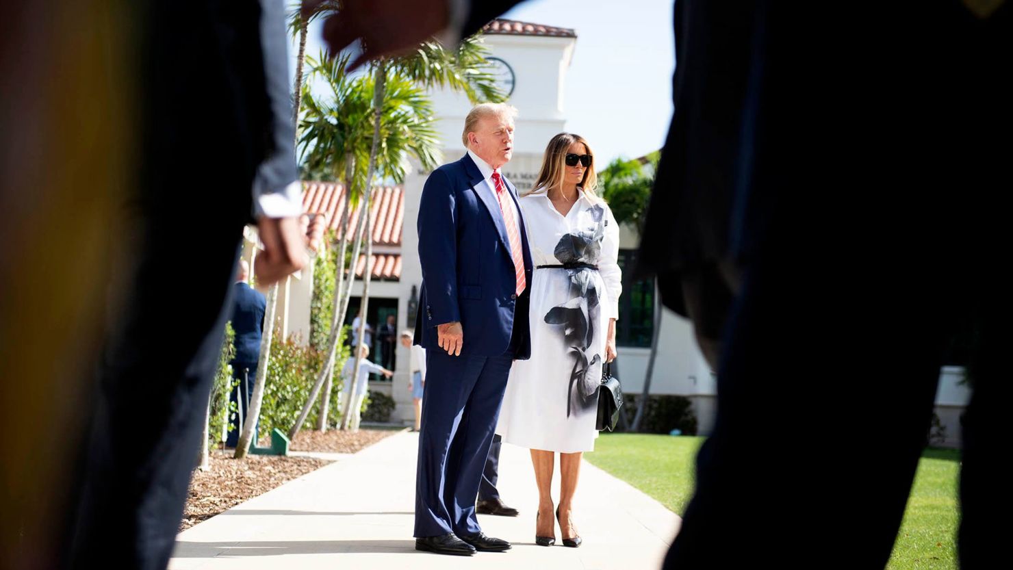 Donald and Melania Trump stand in front of members of the media after casting their votes at the Morton and Barbara Mandel Recreation Center on March 19, in Palm Beach, Florida.