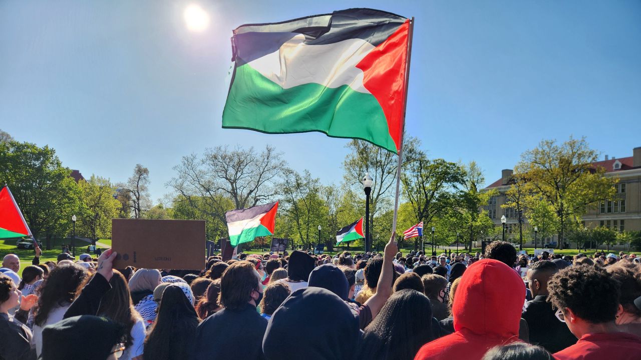 Protestors calling for Ohio State University to divest investment in businesses linked to Israel waved a Palestinian flag at a demonstration outside the Ohio Union on Thursday, April 25.