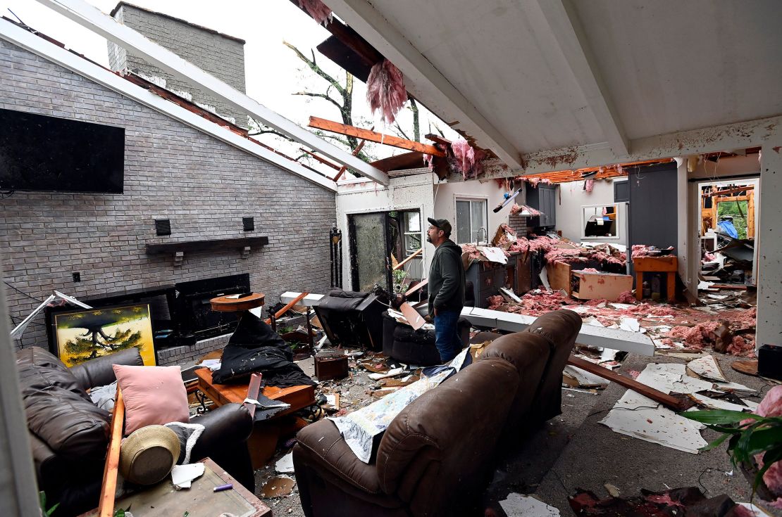 Ryan Whitten walks around his destroyed home Thursday, May 9, 2024, in Columbia, Tennessee.