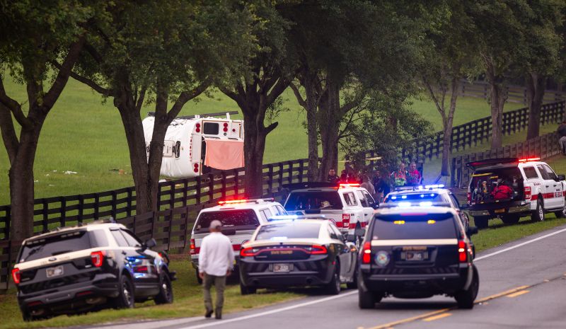 Police and firefighters work Tuesday at the scene of a crash on West Highway 40 in Marion County, Florida.