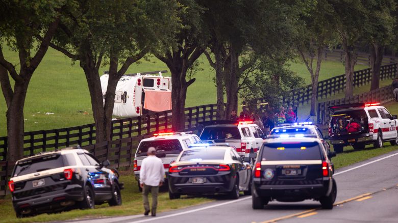 Police and firefighters work Tuesday at the scene of a crash on West Highway 40 in Marion County, Florida.