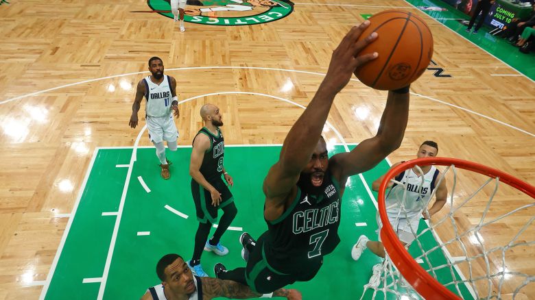 Jun 9, 2024; Boston, Massachusetts, USA; Boston Celtics guard Jaylen Brown (7) dunks the ball against the Dallas Mavericks during the second half during game one of the 2024 NBA Finals at TD Garden.