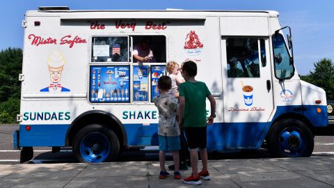 Mister Softee employee Jim McCullough serves ice cream during a bicycle safety event held in Evesham Township, NJ, on Monday, July 15, 2024.