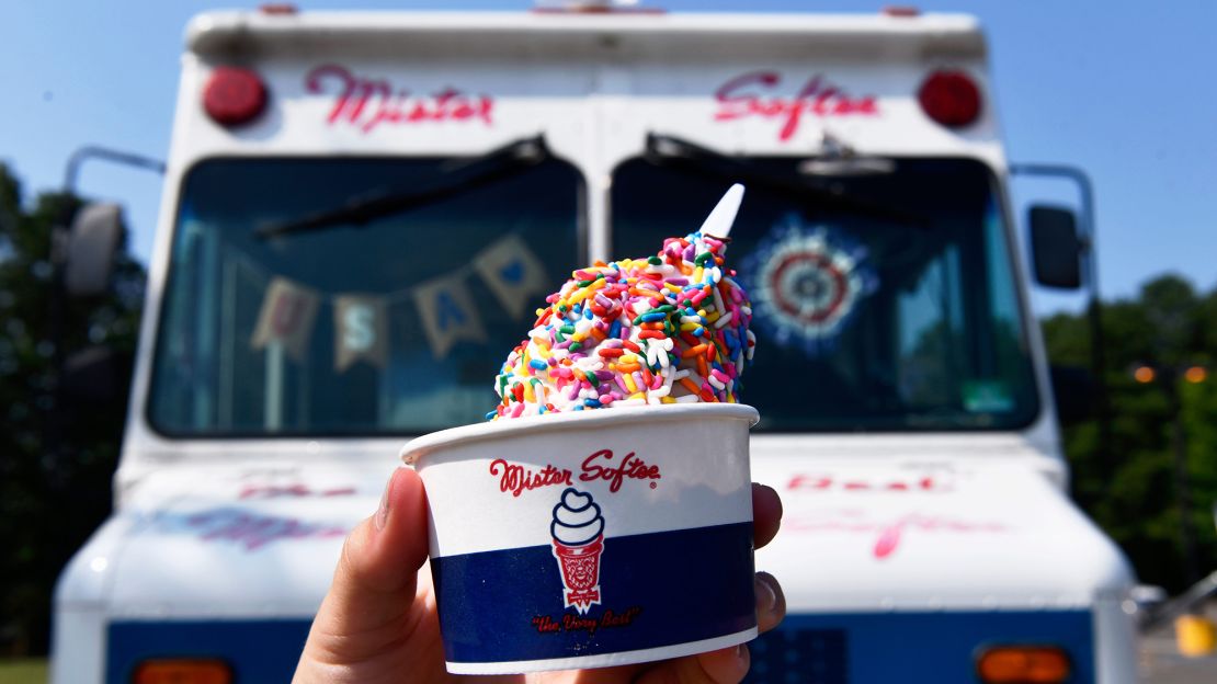 A freshly made cup of Mister Softee ice cream is displayed during a 2024 bicycle safety event in Evesham Township, New Jersey.