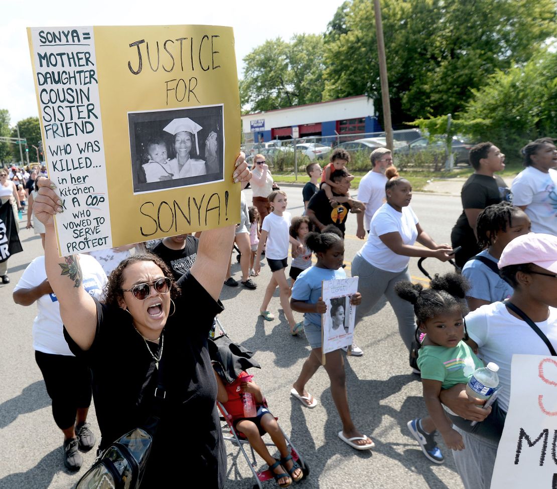 Seirra Helmer of Springfield, left, makes her way from Pleasant Grove Baptist Church to Comer Cox Park on July 22 during a peace march for Sonya Massey.