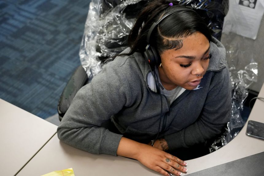 A hotline provider works at her station at the 988 call center on July 30, 2024, in Cincinnati.