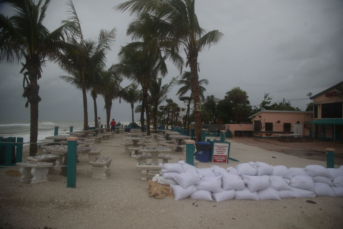 Sandbags are lined up near Bonita Beach in Bonita Springs, Florida, on Sunday, August 4, 2024.