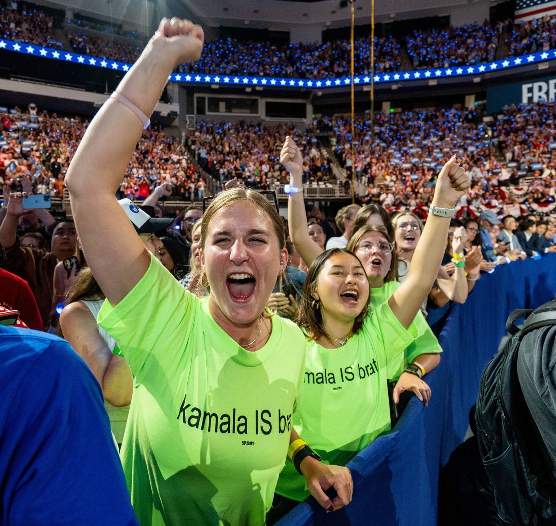 Harris supporters wear custom “Kamala is brat” shirts at a rally in Milwaukee on August 20, 2024.