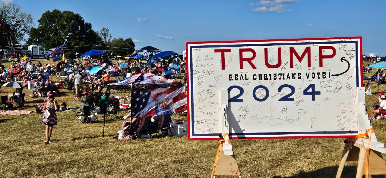 Freedom Fest attendees signed a wooden board in support of former President Donald Trump at Freedom Fest Saturday on September 15 in Northern Kentucky.