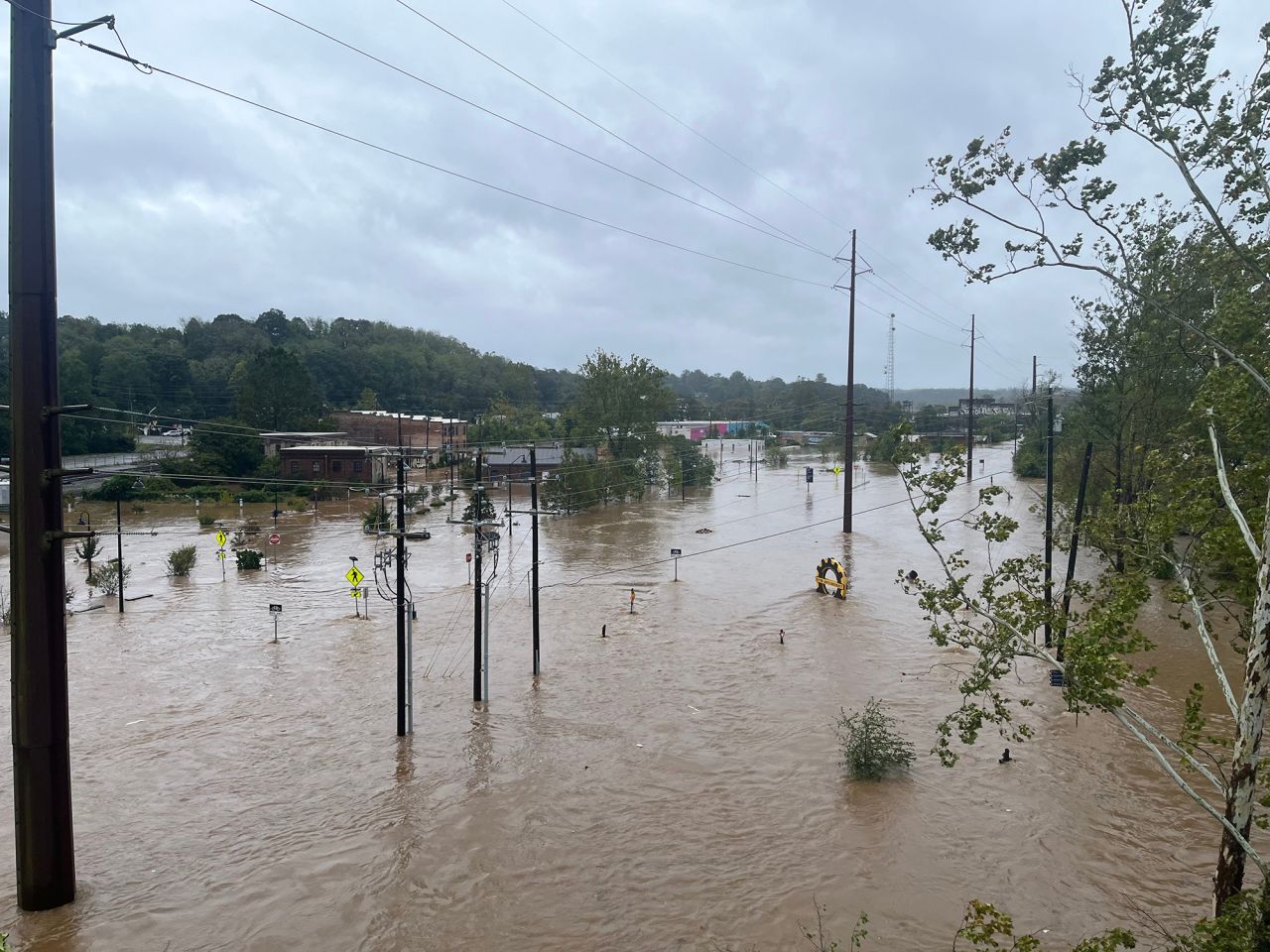 The French Broad River in Asheville reached over 16 feet by 11 am on Friday.