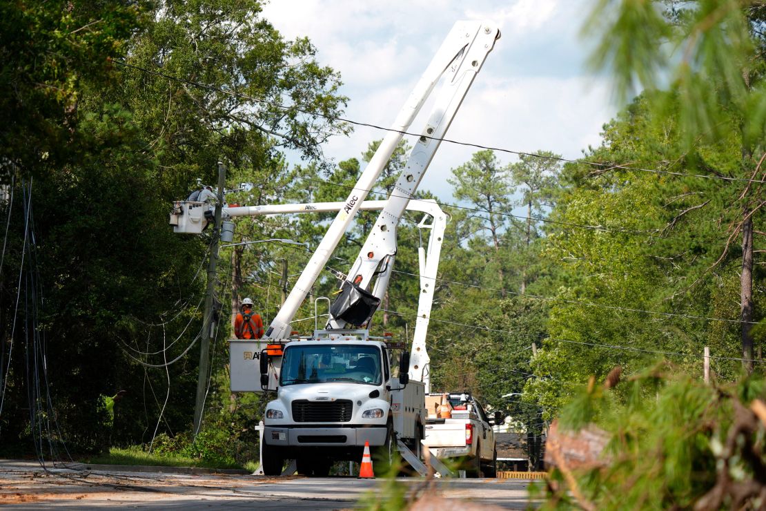 Line workers repair downed lines on Warren Road in Augusta, Ga., on Monday, Sept. 30, 2024.