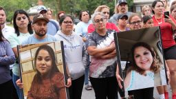 Francesco Guerrero (left) brought a photograph of his wife and Guadalupe Hernandez (right) shows a photograph of her sister during a news conference for the victims and the missing in Erwin, Tennessee, on Sunday.